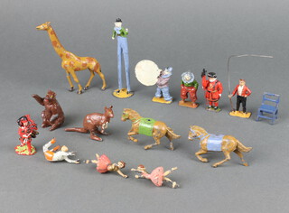 A collection of various Britains circus figures including ring master, 2 clowns, trapeze artist, horses, etc