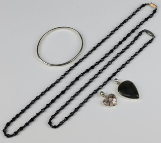 A 925 standard bangle, 2 jet necklaces, 2 pendants