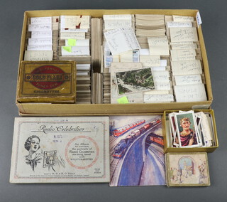 A collection of Wills and Players cigarette cards including film stars, Reign of George V, radio celebrities, railways and locomotives, dogs, products of the world, animals, Dickens characters, cricketers, hints on playing football, etc 