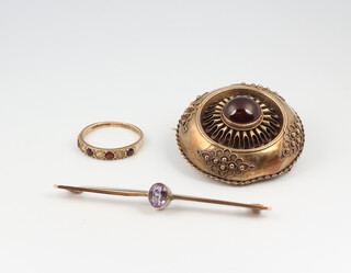 A Victorian gilt etruscan style garnet set brooch, a bar brooch and a 9ct gem set ring 