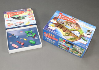 A Matchbox Thunderbirds Tracy Island electronic playset boxed, together with The Thunderbirds commemorative BBC limited edition box set 