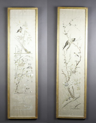 A pair of Chinese silk work embroideries of exotic birds amongst flowers 110cm x 28cm 