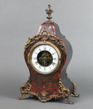 A 19th Century French mantel clock with enamelled dial and Roman numerals, having a visible movement, contained in a shaped red boulle and gilt case 37cm x 21cm x 12cm, complete with pendulum and key 
