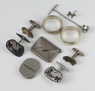 A silver stamp holder in the shape of an envelope, 2 pairs of silver cufflinks, 2 rings and a pendant, gross weight 39.3 grams