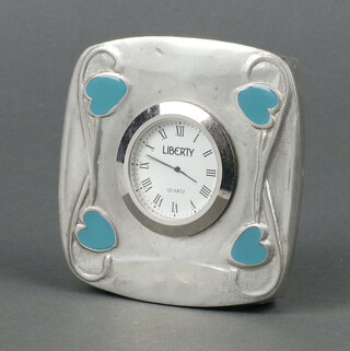 Liberty, a quartz timepiece with 4cm circular dial marked Liberty Quartz, contained in a pewter and blue enamel case 10cm x 10cm x 2cm 