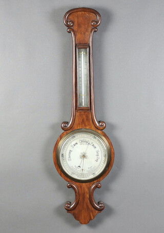 A Victorian aneroid barometer and thermometer with silvered dial contained in a mahogany wheel case 94cm h x 26cm w x 4cm d 
