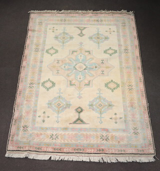 A white, pink and green ground Turkish Caucasian style carpet with central medallion within multi row borders 215cm x 280cm 