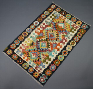 A white, black and green ground Chobi Kilim rug with geometric designs 153cm x 100cm 