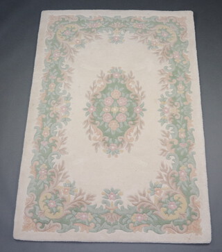 A white ground and floral patterned Indian rug 182cm x 124cm  