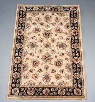 A brown and black ground Persian style machine made rug with floral design to the centre 180cm x 120cm 