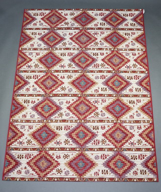A white, turquoise and tan ground Kilim style machine made rug 215cm x 155cm 
 