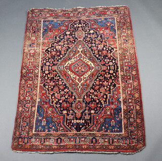 A blue and red ground North West Persian rug with central medallion 165cm x 113cm 