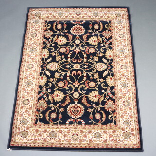 A black and gold ground Persian style machine made rug 169cm x 121cm 