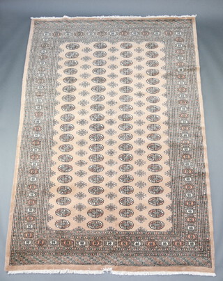 A sand and black ground Bokhara carpet with 76 octagons to the centre 275cm x 189cm 
