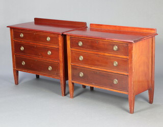 A pair of Edwardian inlaid mahogany chests with raised backs and 3 drawers, raised on square tapered supports 81cm h x 91cm w x 48cm d 