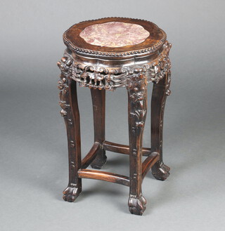 A Chinese 19th Century pierced carved hardwood and pink veined marble jardiniere stand, raised on cabriole supports 60cm h x 34cm diam. 