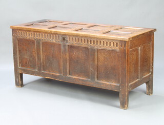 An 18th Century panelled oak coffer with hinged lid and iron butterfly hinges, the interior fitted a glove box 75cm h x 157cm w x 64cm d