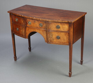 A 19th Century mahogany and crossbanded bow front sideboard fitted a drawer flanked by cupboards enclosed by panelled doors, raised on square tapered supports, spade feet  83cm h x 105cm w x 54cm d 