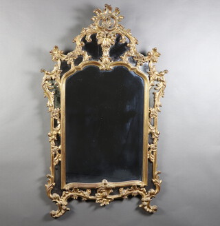 A 1950/60's Chippendale style plate mirror contained in a carved gilt wood frame 140cm x 83cm 
