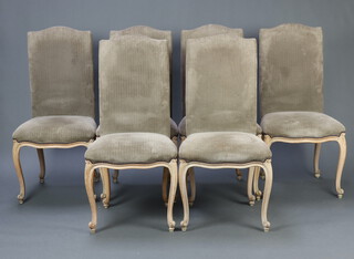 A set of 6 French style high back dining chairs upholstered in mushroom coloured material, raised on cabriole supports 106cm h x 50cm w x 46cm d (seat 32cm x 31cm) 