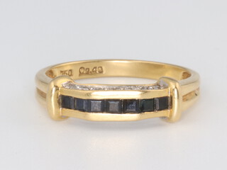 A yellow metal 750 sapphire and diamond ring, 3.7 grams, size P 1/2 