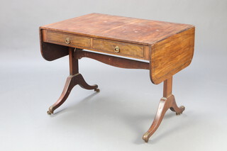 A 19th Century mahogany sofa table with ebony stringing fitted 2 drawers, raised on standard end supports, brass caps and casters 71cm h x 92cm w x 66cm d 