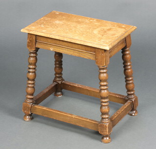 A rectangular light oak joined stool raised on bobbin turned supports with box framed stretcher 46cm x 44cm x 27cm 