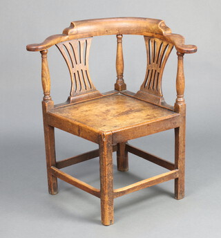 An 18th/19th Century oak slat back corner chair with pierced vase shaped slat back and solid seat, raised on square supports with box framed stretcher 77cm h x 75cm w x 62cm (seat 50cm x 44cm) 