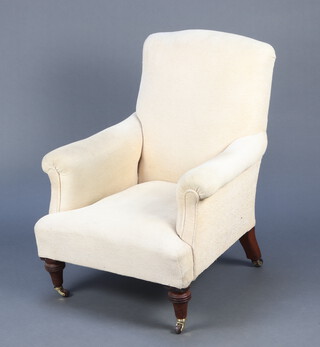 A Howard style armchair upholstered in yellow material, raised on turned supports 89cm h x 69cm x 64cm (seat 31cm x 36cm)  