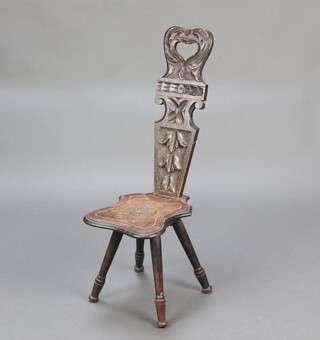 A 19th Century carved oak spinning chair with solid back and shaped seat, raised on turned supports 87cm h x 28cm w x 36cm d (seat 15cm x 19cm) 