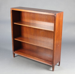 A Georgian style mahogany bookcase with adjustable shelves, raised on square supports 96cm h x 91cm w x 24cm d 