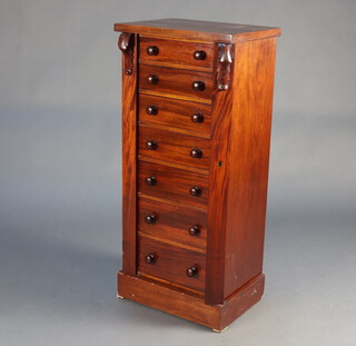 A Victorian mahogany Wellington chest of 7 drawers with turned handles, raised on a platform base 105cm h x 47cm w x 35cm d 