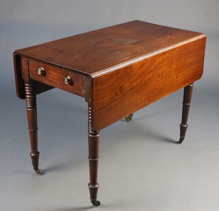 A 19th Century mahogany Pembroke table fitted a frieze drawer, raised on ring turned supports with brass caps and casters 73cm h x 101cm w x 50cm d 