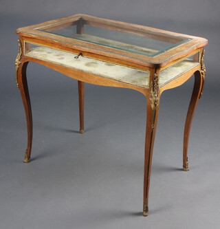 A 19th/20th Century rectangular inlaid bleached Kingwood bijouterie table with hinged lid, raised on cabriole supports with gilt metal mounts throughout 73cm h x 81cm w x 41cm d 

