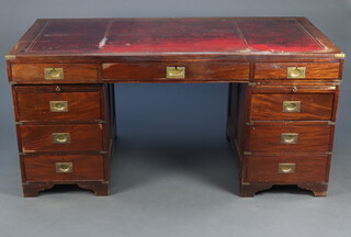 A military style mahogany pedestal desk with red inset writing surface, fitted 1 long and 8 short drawers with brass countersunk handles and brushing slides to the pedestals, raised on bracket feet 78cm h x 166cm w x 84cm d 