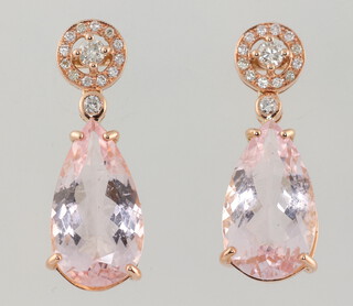 A pair of rose gold 750 morganite and diamond drop earrings, the pear cut morganites 8.25ct, the brilliant cut diamonds 0.32ct, 5.4 grams, 25mm 