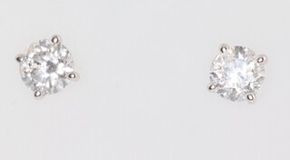 A pair of white metal 750 single stone diamond ear studs, approx. 1.03ct, 1.4 grams 