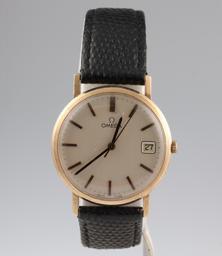 A gentleman's 9ct yellow gold Omega calendar wristwatch, the case stamped 1325017, movement 39/104442, contained in a 32mm case with a leather strap and Omega clasp, boxed 