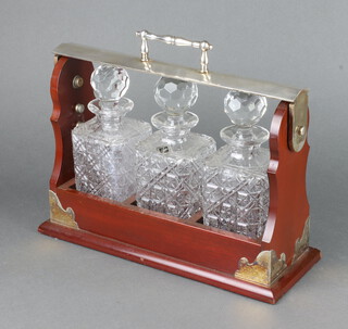 A silver plated mounted mahogany finished 3 bottle tantalus 36cm 