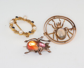 A yellow metal moonstone bug brooch, a similar bug brooch and a 9ct yellow gold sapphire and pearl brooch 