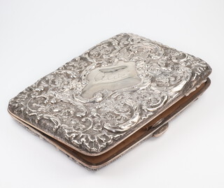 A Victorian repousse silver aide memoir/purse with scroll floral decoration, London 1896 