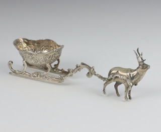 A Continental silver 925 standard model of a deer pulling a sleigh with scroll decoration 15.5cm, 62 grams 