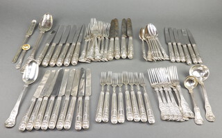 A George III, George IV and Victorian matched canteen of silver cutlery with rose handles and shell backs with engraved armorial, comprising a George IV basting spoon London 1820, a George IV tablespoon 1823, a Victorian silver ladle 1860, a pair of small ladles 1846, a mustard spoon 1846, a George III marrow scoop 1819, 10 dinner forks - George III 1819, George IV 1825 and Victoria 1846, 8 dessert forks - George IV 1820 and Victoria 1860 and 8 dessert spoons Victoria 1860, all London, mixed maker, 2920 grams together with 10 silver handled dinner knives with steel blades, 15 dessert knives - 7 with silver blades and 8 dessert forks with silver prongs 