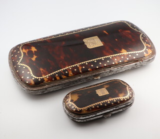 A 19th Century tortoiseshell and gilt inlaid steel cased spectacle case with engraved monogram 15cm and a smaller ditto 6.5cm 