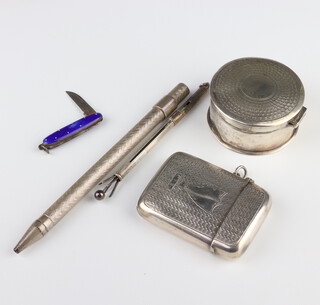 A circular silver engine turned box Birmingham 1942 together with a silver vesta, propelling pencil, miniature penknife and cocktail stirrer 