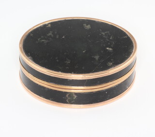 A 19th Century hardstone and gilt metal mounted circular snuff box 8cm 