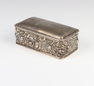 An Edwardian repousse silver rounded rectangular trinket box decorated with flower, inscribed S S Mina, Brea, launched 10 March 1909 13cm, Sheffield 1907, maker Walker and Hall 220 grams 