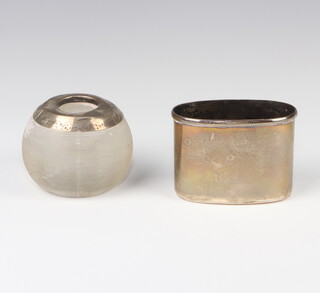 A silver hip flask cup base, London 1905 together with a silver mounted cut glass match striker (dented) 