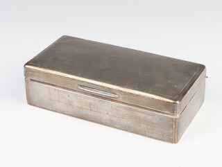 A rectangular silver engine turned cigarette box London 1923, engraved monogram 18cm 