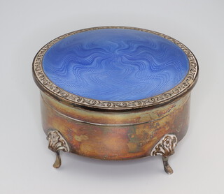 A silver and blue guilloche enamel circular trinket box on scroll feet 8cm, Birmingham 1928 